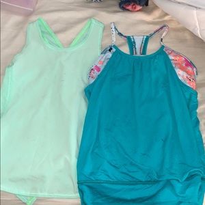 2 stained ivivva tanks